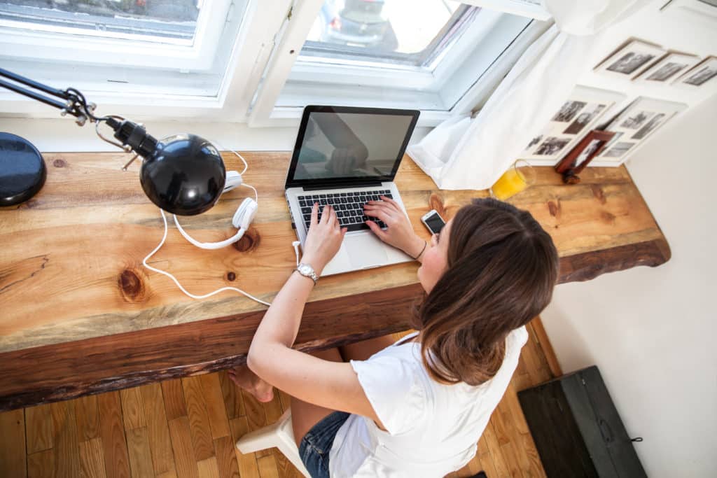 woman typing on computer